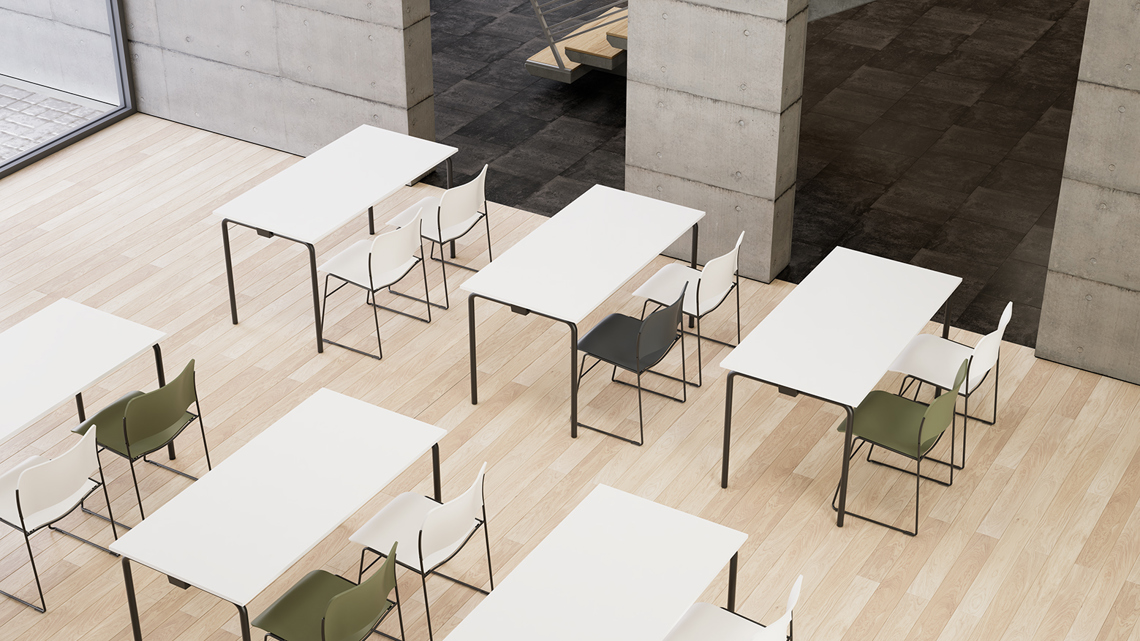 A classroom setting with white Usu tables plus white and olive green 40/4 chairs