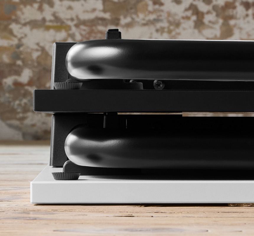 A closeup image of two stacked Usu tables on the wooden floor