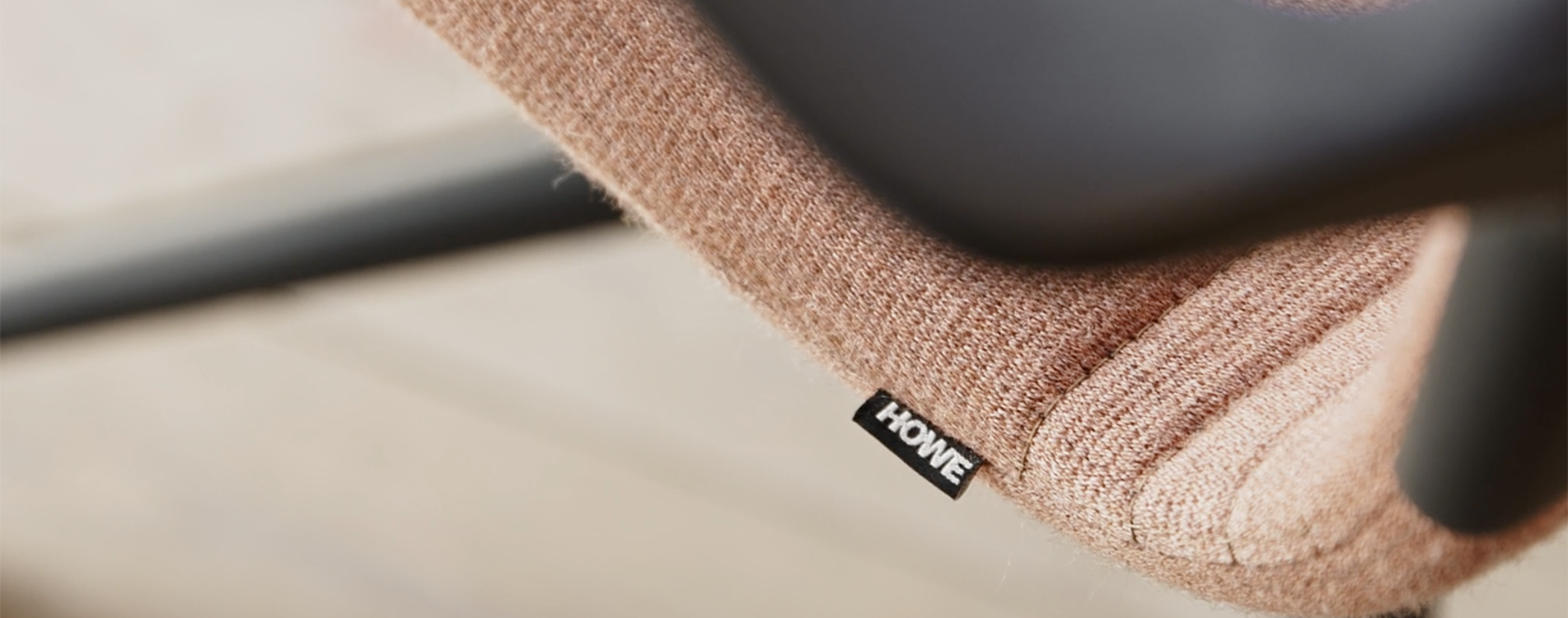 A close-up image of the armrest of the AS100 chair