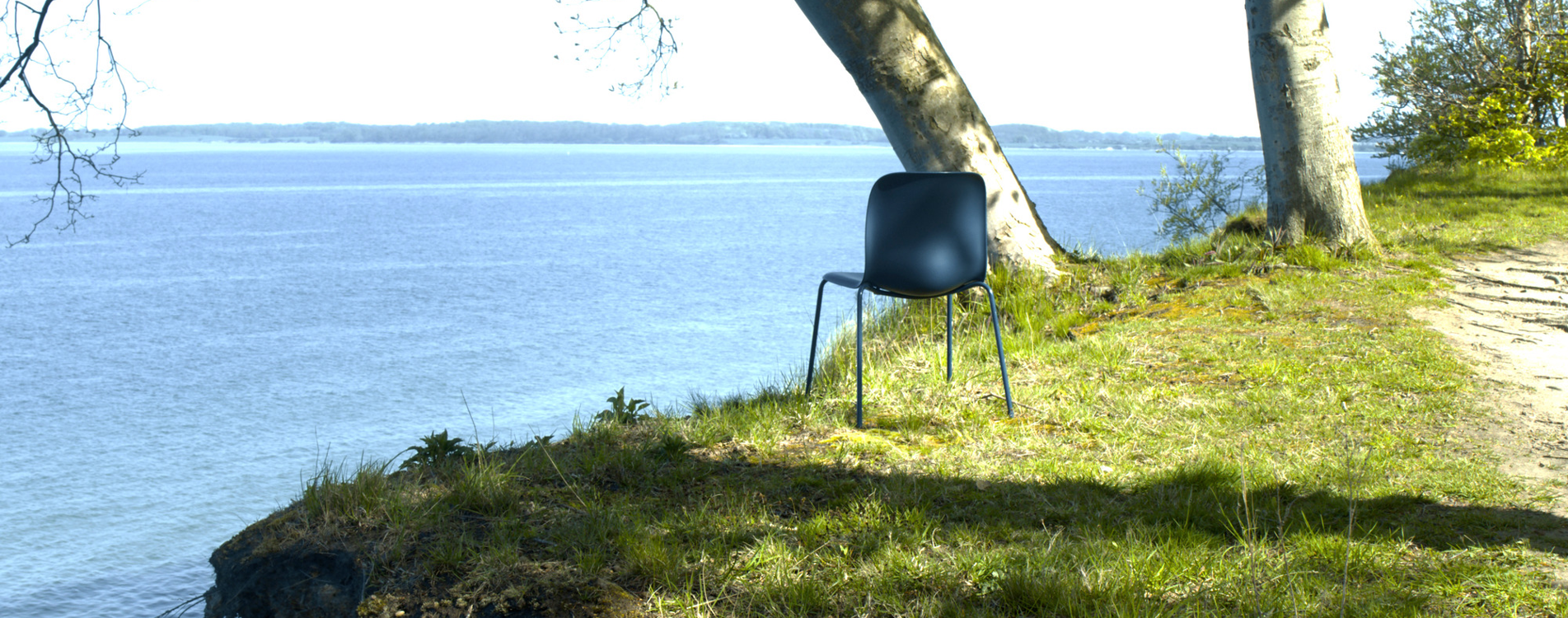 SixE chair captured on a hill by the sea