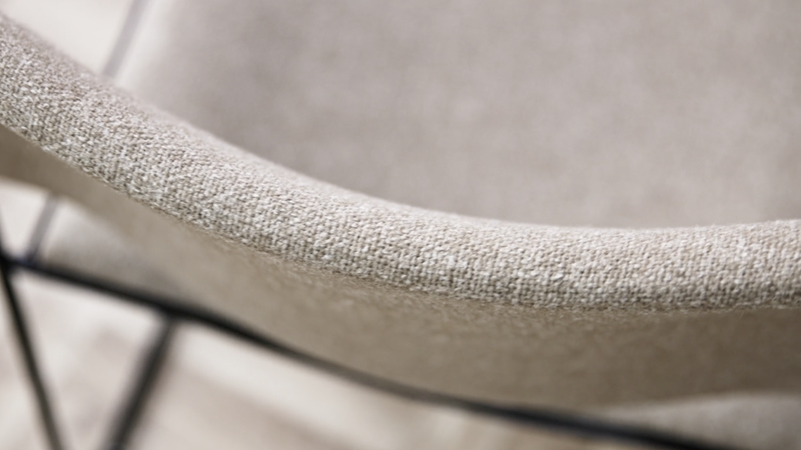 A detailed image of the back of an upholstered 40/4 chair