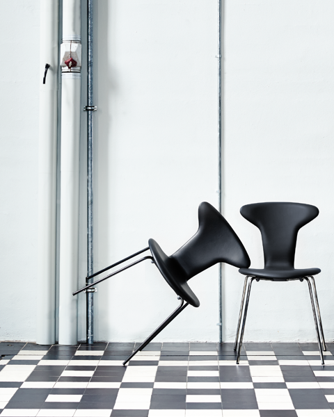An installation image with two Munkegaard chairs upholstered in black leather