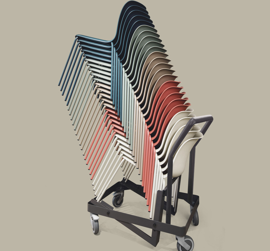 An image of a stack of SixE chairs on a beige background