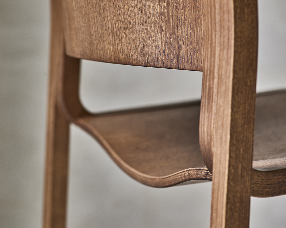 A close-up image of a 40/4 wood frame chair