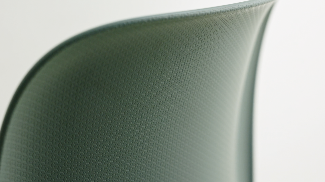 A detailed image of the back of a plastic SixE chair