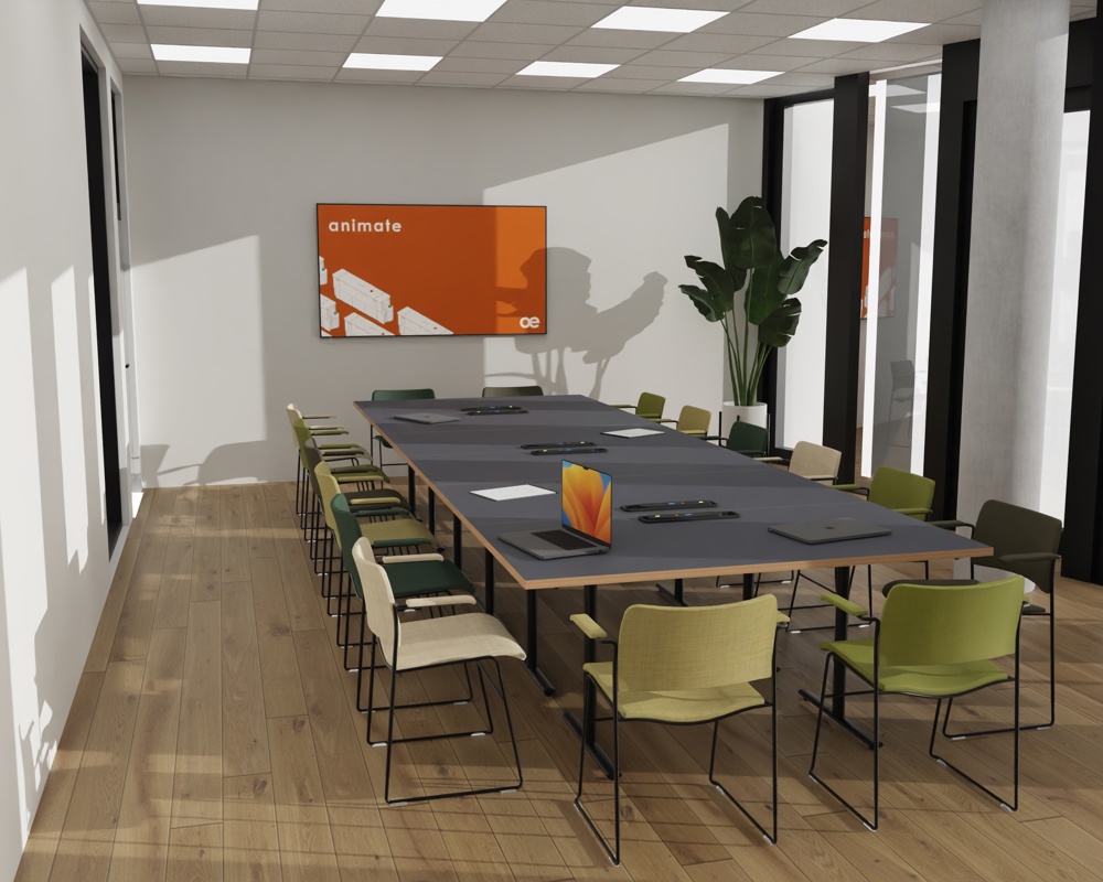 An installation image featuring the Tempest table accompanied by greenish 40/4 chairs