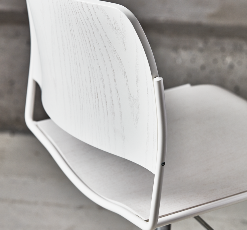 A closeup image of a white veneer 40/4 swivel chair