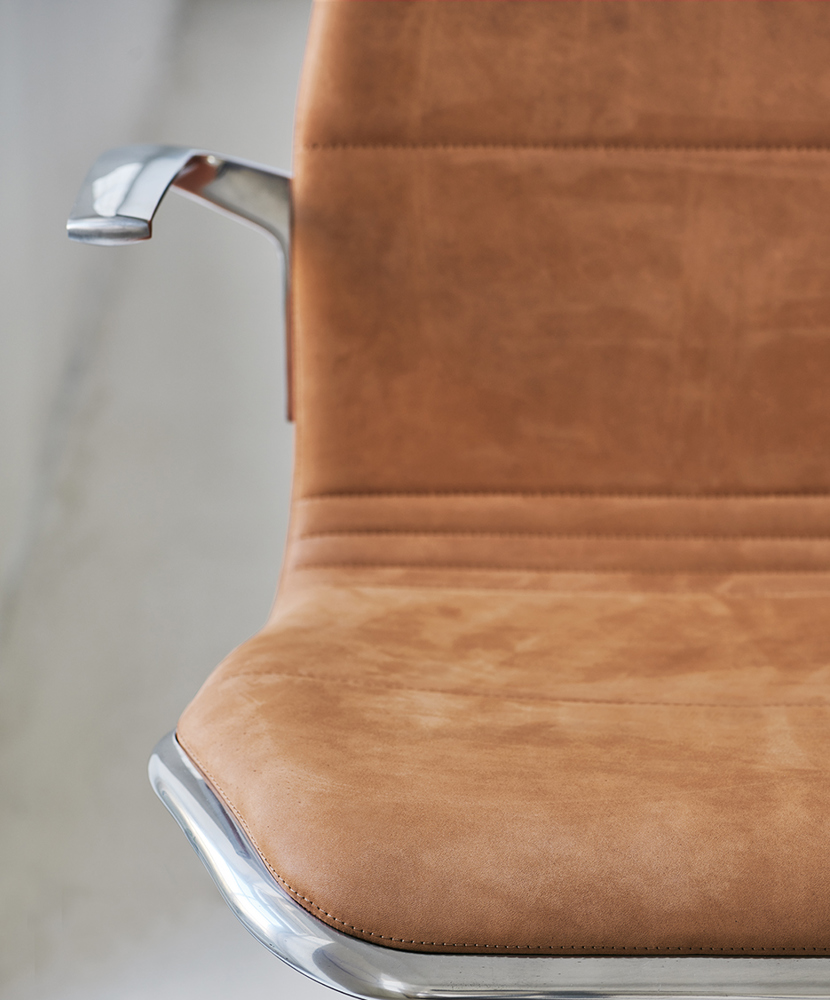 A close-up image of the AS100 chair with leather upholstery