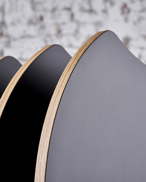 A stack of round concave AS400 tables; part of the AS series