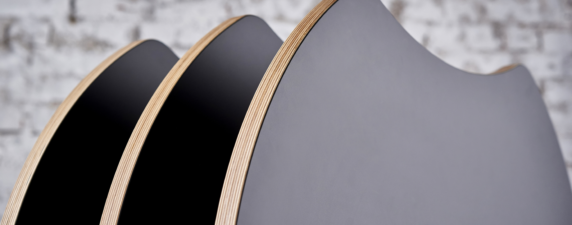 A stack of round concave AS400 tables; part of the AS series