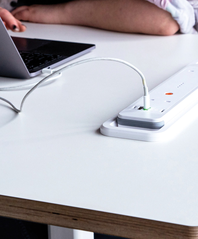 A close-up image of a white tabletop with a built-in battery