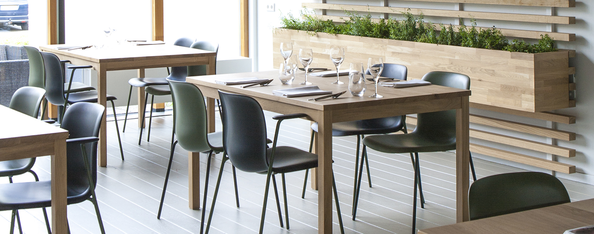 SixE chairs around wooden tables in a restaurant