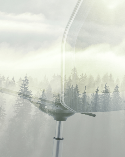 An image of a MN1 chair on a forest background; sustainability related 