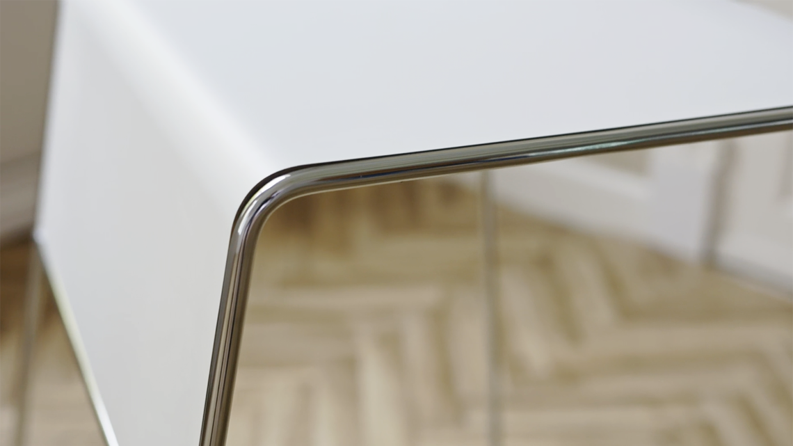 A detailed image of a white Tutor table